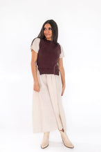 Load image into Gallery viewer, Woman wearing a cream floral print dress with a burgundy vest.
